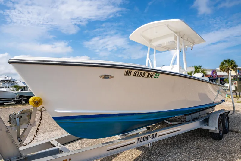 Slide: The Image of 2016 Albury Brothers 23 boat on trailer under blue sky. - 4