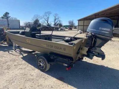 Slide: The Image of 2025 G3 Gator Tough 18 CCJ boat with Yamaha outboard motor on a trailer. - 3