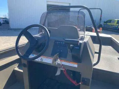 Slide: The Image of 2025 G3 Gator Tough 18 CCJ boat console with steering wheel and controls. - 5