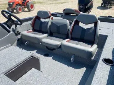 Slide: The Image of 2025 G3 Sportsman 1710 boat interior with three gray seats and steering wheel. - 10