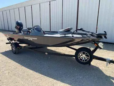 Slide: The Image of 2025 G3 Sportsman 1710 boat on trailer, parked outdoors. - 2