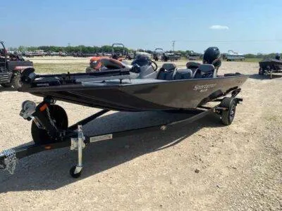 Slide: The Image of 2025 G3 Sportsman 1710 boat on trailer, parked outdoors on gravel. - 3