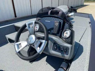 Slide: The Image of 2025 G3 Sportsman 1710 boat dashboard with steering wheel and control panel. - 7