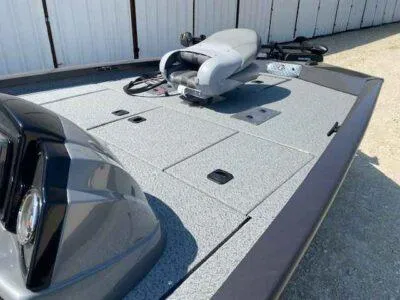 Slide: The Image of 2025 G3 Sportsman 1710 PFX boat deck with seating and storage compartments. - 10