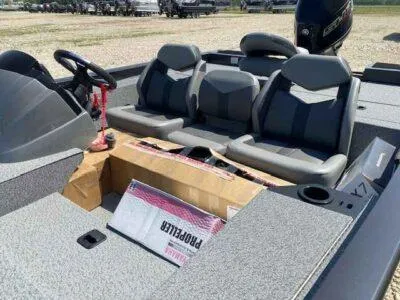 Slide: The Image of 2025 G3 Sportsman 1710 PFX boat interior with three seats and steering wheel. - 9