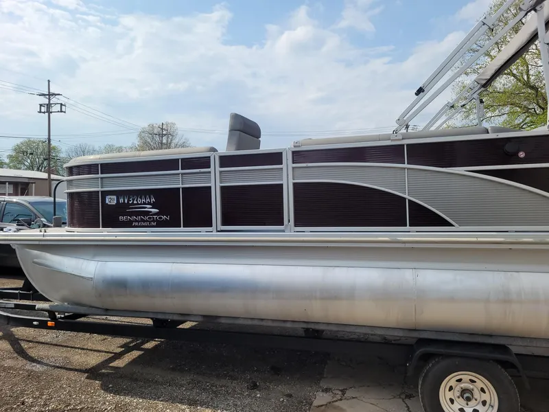 Slide: The Image of 2020 Bennington 22 SSBXP pontoon boat on trailer, side view, outdoors. - 11