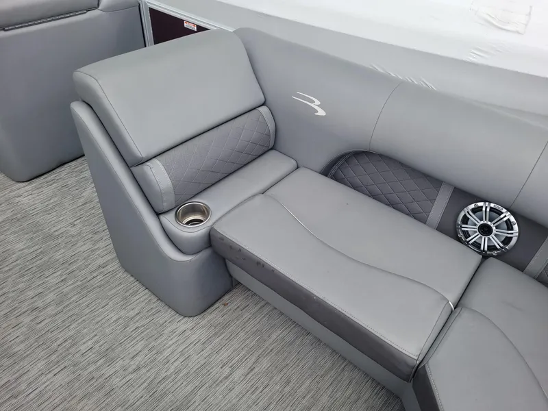 Slide: The Image of 2020 Bennington 22 SSBXP boat interior with gray seating and cup holder. - 4
