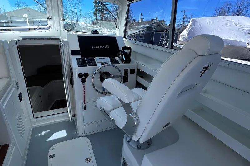 Slide: The Image of 2022 Steiger Craft 31 Chesapeake helm with Garmin navigation system and captain's chair. - 10