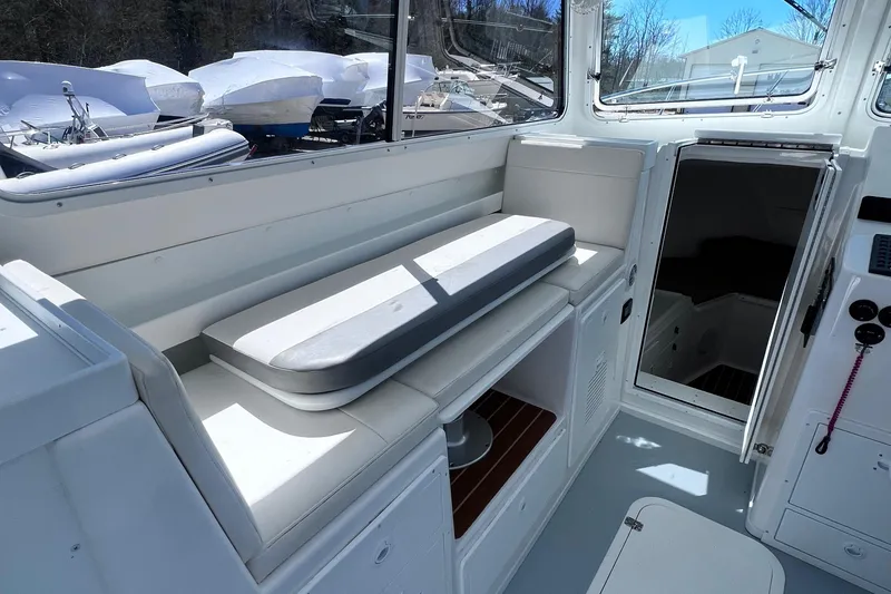 Slide: The Image of 2022 Steiger Craft 31 Chesapeake boat interior with seating and storage. - 13