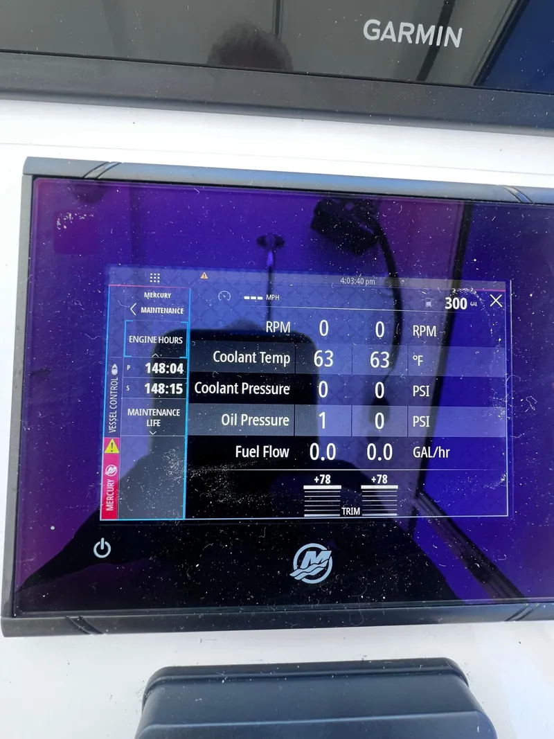 Slide: The Image of Steiger Craft 31 Chesapeake 2022 boat dashboard display showing engine metrics and Garmin navigation. - 15