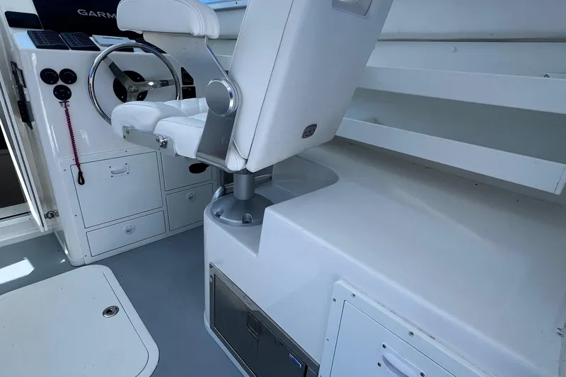 Slide: The Image of 2022 Steiger Craft 31 Chesapeake boat interior with helm and seating area. - 16