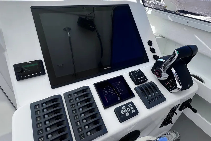 Slide: The Image of Control panel of 2022 Steiger Craft 31 Chesapeake boat with advanced navigation system. - 17