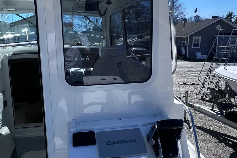 Slide: The Image of 2022 Steiger Craft 31 Chesapeake boat with Garmin navigation system, docked outdoors. - 23