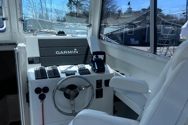Slide: The Image of Steiger Craft 31 Chesapeake 2022 boat helm with Garmin navigation system. - 24