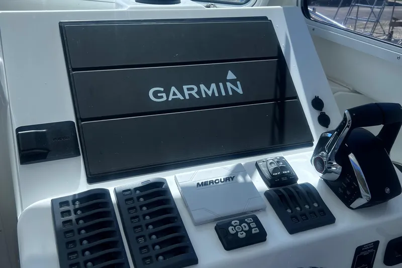 Slide: The Image of Control panel of 2022 Steiger Craft 31 Chesapeake with Garmin and Mercury systems. - 25