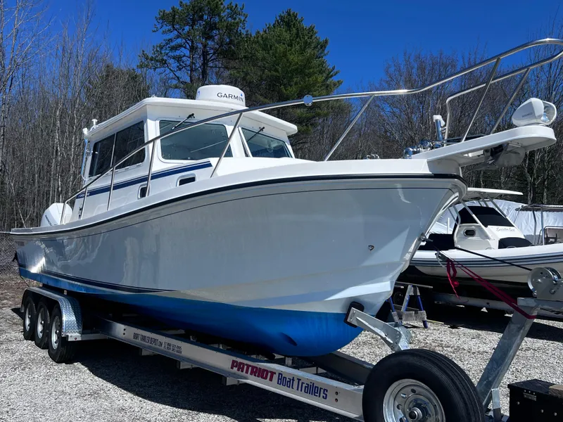 Slide: The Image of 2022 Steiger Craft 31 Chesapeake boat on trailer, parked outdoors. - 29