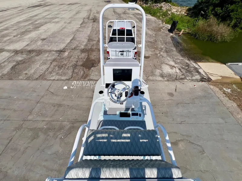 Slide: The Image of 2022 Shallow Sport 20 Classic boat on a concrete ramp near water. - 11