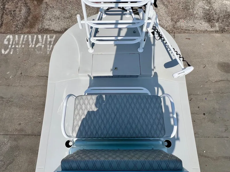 Slide: The Image of 2022 Shallow Sport 20 Classic boat with seating and trolling motor, viewed from above. - 14