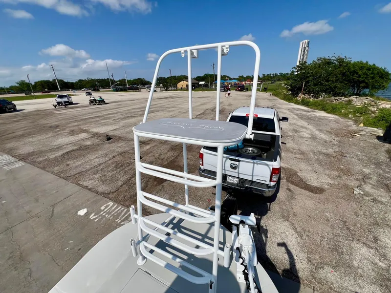 Slide: The Image of 2022 Shallow Sport 20 Classic boat on trailer, parked in a sunny lot. - 17