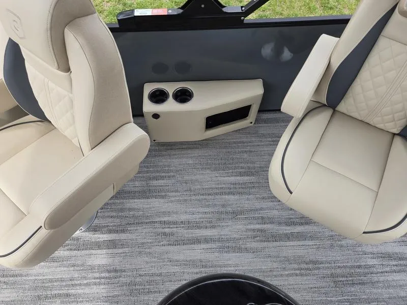 Slide: The Image of Luxurious seating in 2025 Godfrey Sweetwater 2286 QS boat with cup holders and modern design. - 2