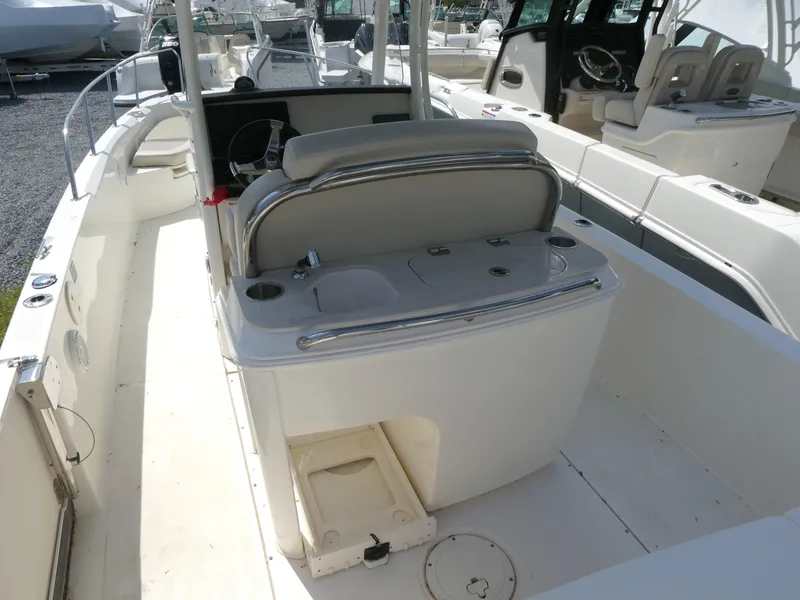 Slide: The Image of 2022 Boston Whaler 270 Dauntless boat interior with seating and console. - 12