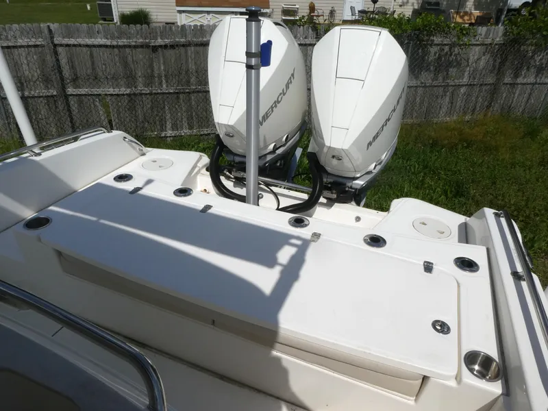 Slide: The Image of 2022 Boston Whaler 270 Dauntless boat with dual Mercury outboard engines, rear deck view. - 3