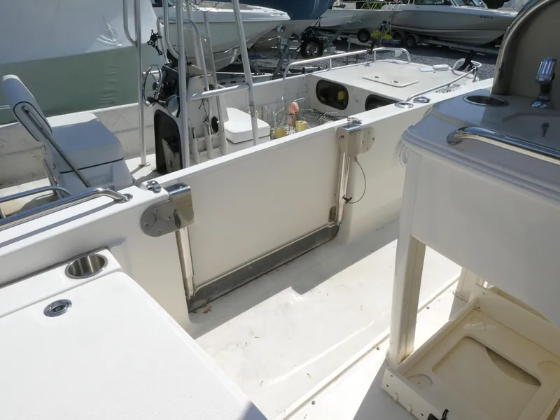 Slide: The Image of 2022 Boston Whaler 270 Dauntless interior, showcasing seating and storage features. - 5