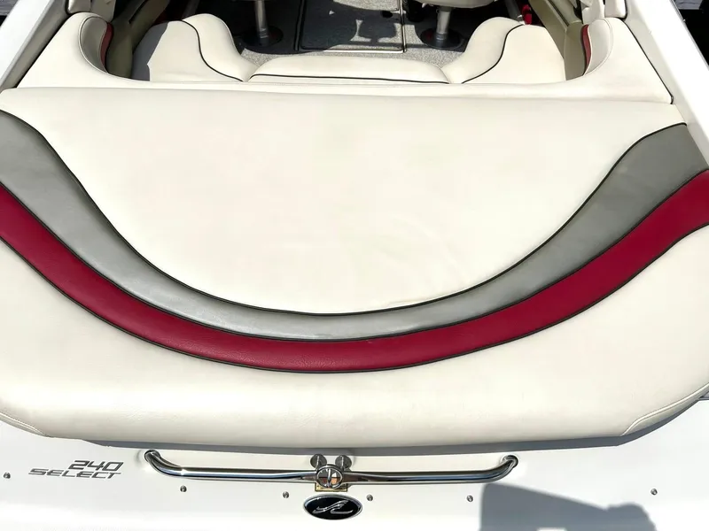 Slide: The Image of 2004 Sea Ray 240 Select boat interior with white, gray, and red upholstery. - 21