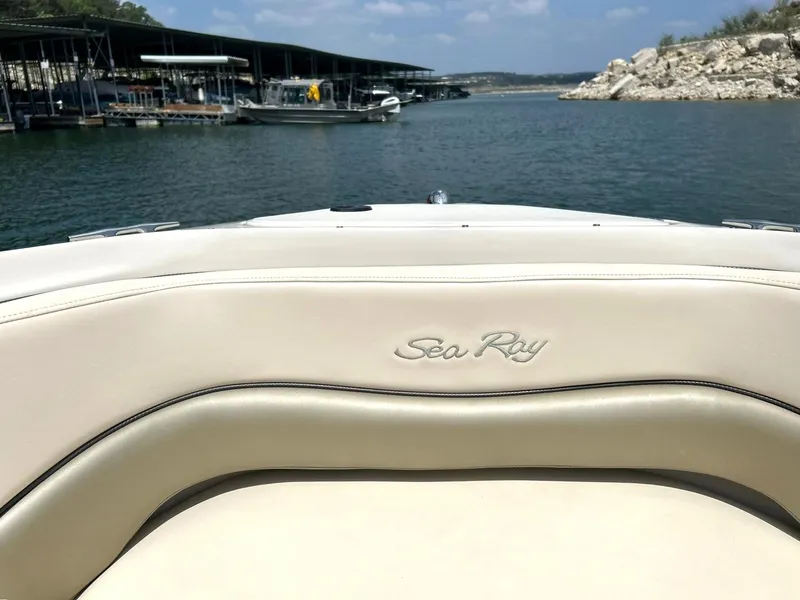 Slide: The Image of 2004 Sea Ray 240 Select boat interior with lake and marina view. - 36