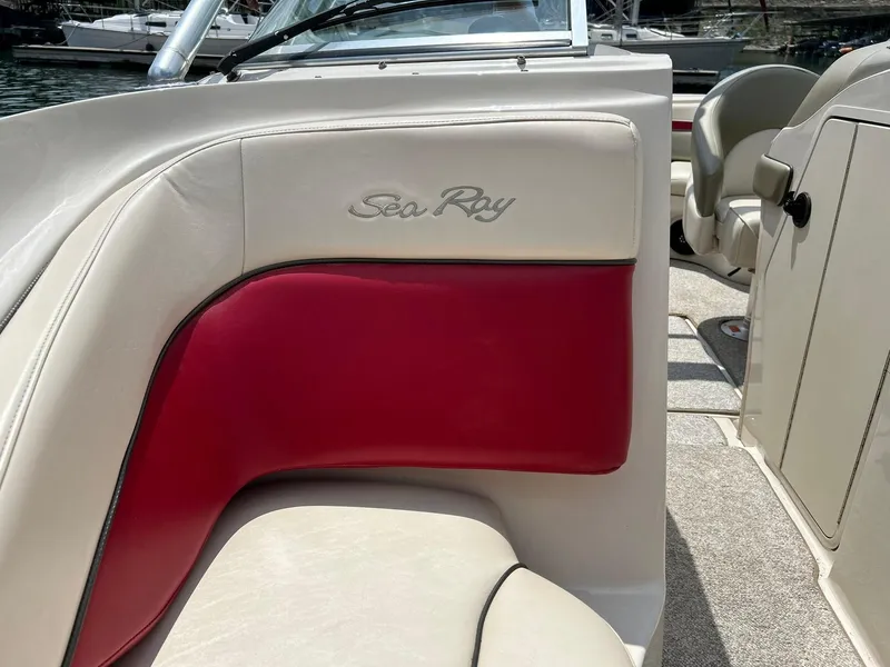 Slide: The Image of 2004 Sea Ray 240 Select boat interior with red and cream seating. - 38