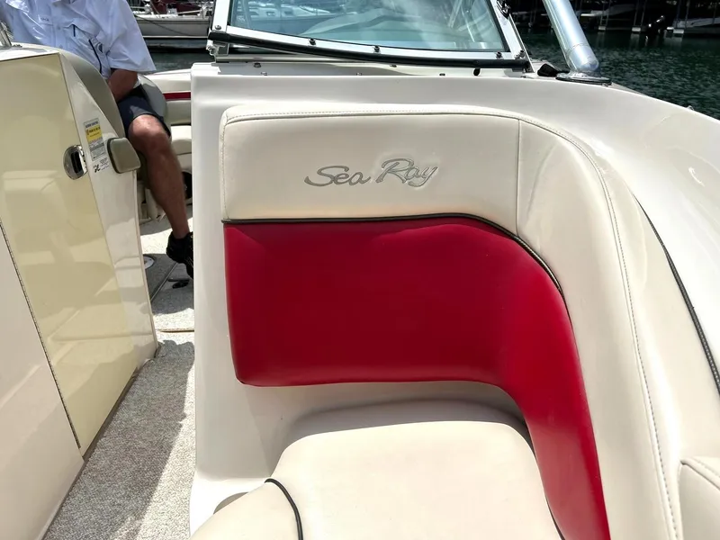 Slide: The Image of 2004 Sea Ray 240 Select boat interior with red and beige seating. - 39