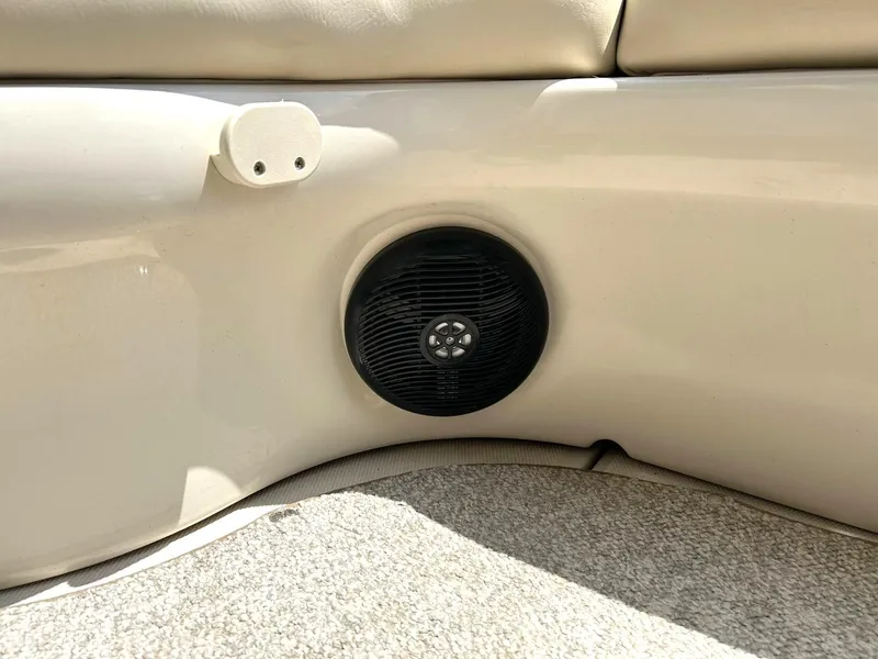 Slide: The Image of Speaker and seating area in 2004 Sea Ray 240 Select boat interior. - 43