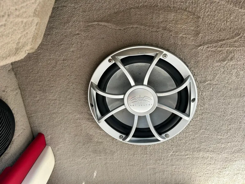 Slide: The Image of Speaker on 2004 Sea Ray 240 Select boat interior, featuring a sleek design. - 45