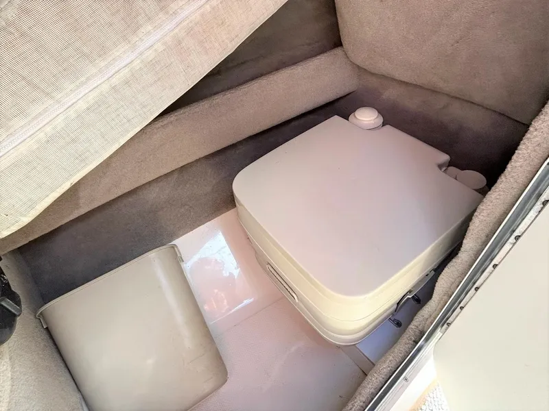 Slide: The Image of Portable toilet in 2004 Sea Ray 240 Select boat interior compartment. - 46