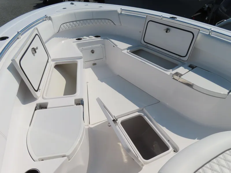 Slide: The Image of 2021 Sportsman Open 282 Center Console boat interior with open storage compartments. - 14