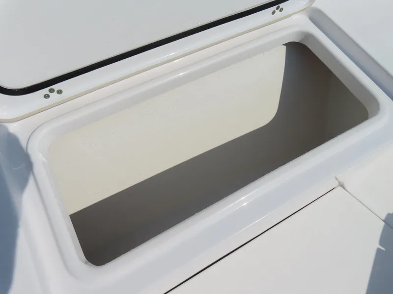 Slide: The Image of Open storage compartment on 2021 Sportsman Open 282 Center Console boat. - 17