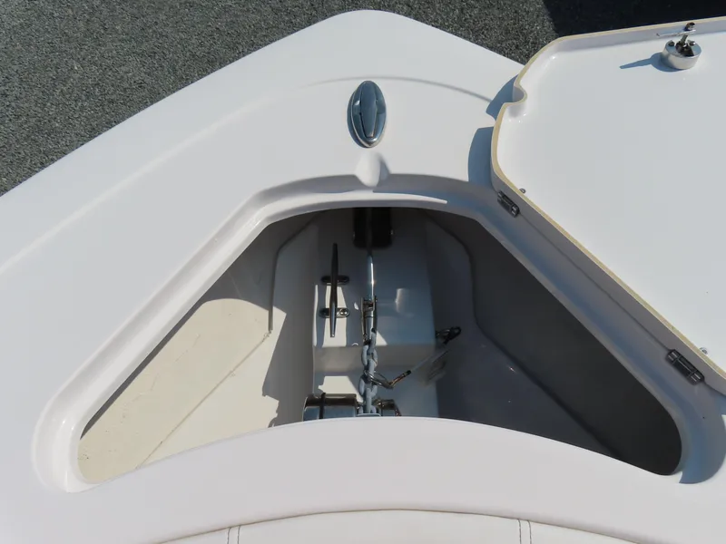 Slide: The Image of 2021 Sportsman Open 282 Center Console anchor compartment with open hatch. - 19