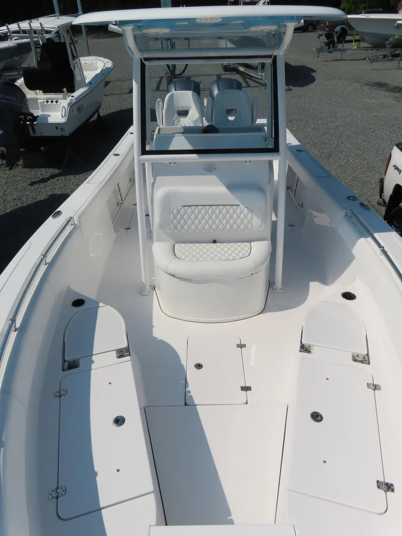 Slide: The Image of 2021 Sportsman Open 282 Center Console boat with spacious seating and sleek design. - 20
