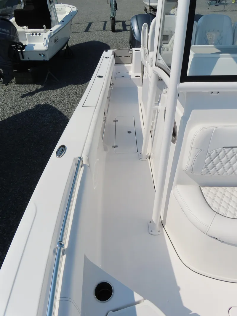 Slide: The Image of 2021 Sportsman Open 282 Center Console boat, featuring spacious deck and seating. - 21