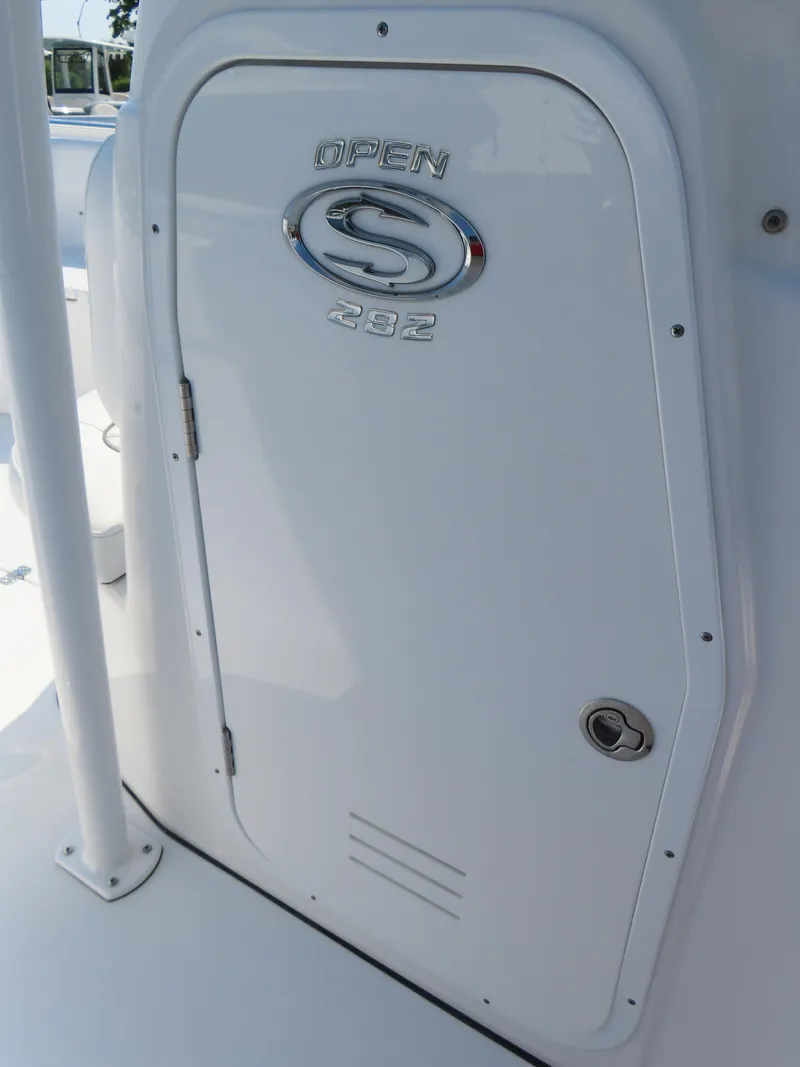 Slide: The Image of 2021 Sportsman Open 282 Center Console boat door with logo. - 23