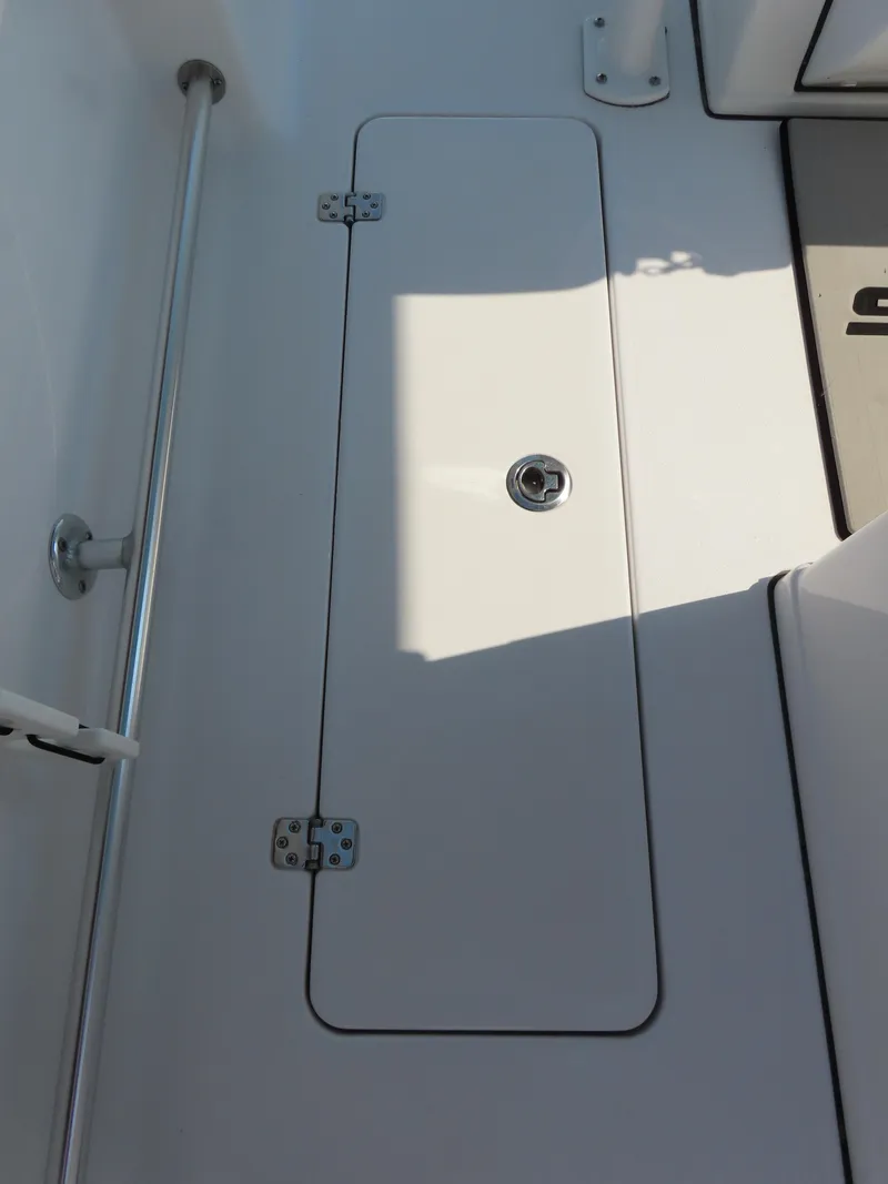 Slide: The Image of 2021 Sportsman Open 282 Center Console deck hatch with stainless steel hardware. - 38