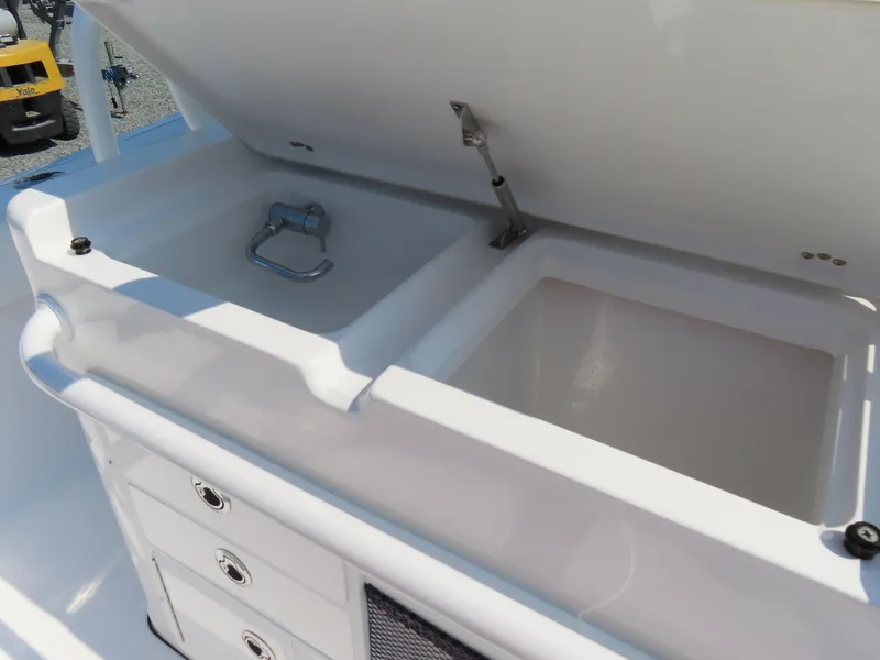Slide: The Image of 2021 Sportsman Open 282 Center Console boat sink and storage compartments. - 41