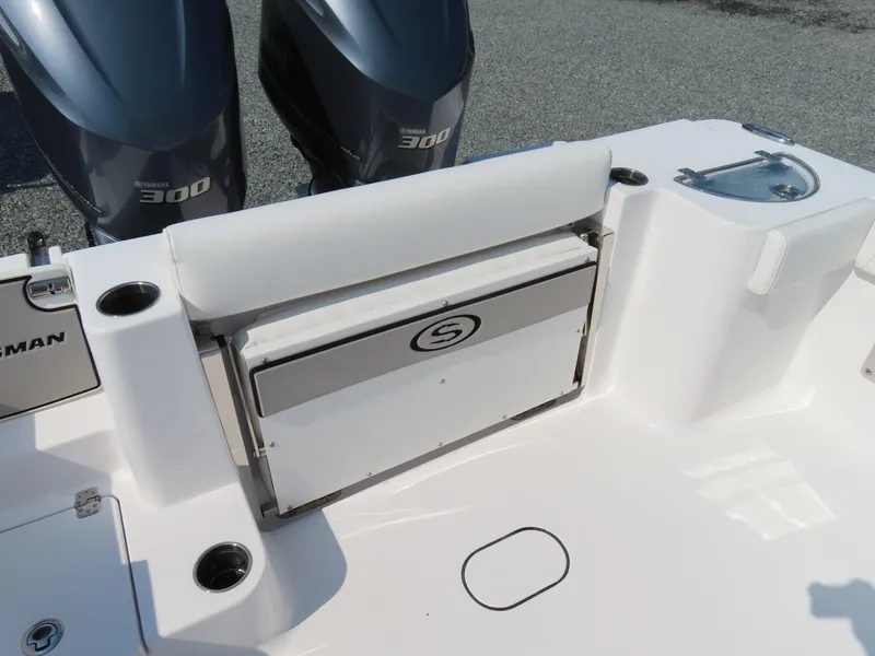 Slide: The Image of 2021 Sportsman Open 282 Center Console boat with Yamaha 300 engines, rear seating, and storage. - 43