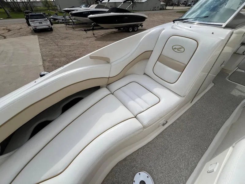 Slide: The Image of 2003 Sea Ray 290 Bowrider interior with white leather seating and elegant design. - 13