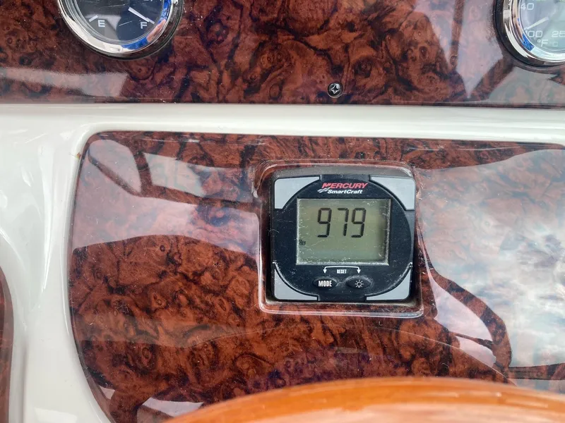 Slide: The Image of Dashboard of 2003 Sea Ray 290 Bowrider showing 979 hours on Mercury SmartCraft gauge. - 21