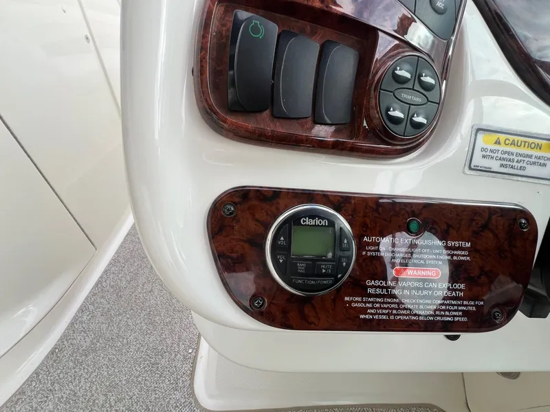 Slide: The Image of Control panel of a 2003 Sea Ray 290 Bowrider boat with Clarion audio system. - 23