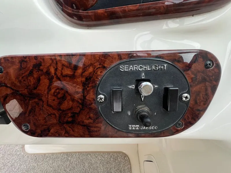 Slide: The Image of Control panel for searchlight on 2003 Sea Ray 290 Bowrider boat. - 24