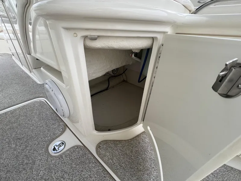 Slide: The Image of Open storage compartment on a 2003 Sea Ray 290 Bowrider boat. - 30