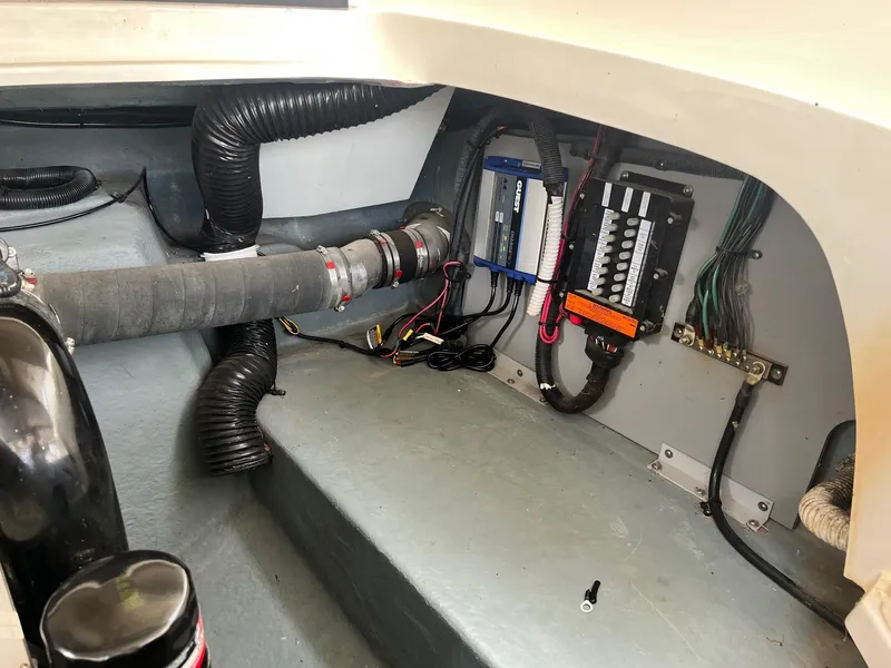 Slide: The Image of 2003 Sea Ray 290 Bowrider engine compartment with wiring and ventilation system. - 38