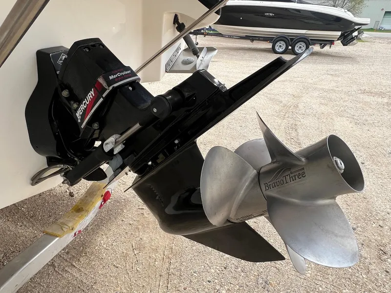 Slide: The Image of 2003 Sea Ray 290 Bowrider with MerCruiser Bravo Three outdrive and propeller. - 4
